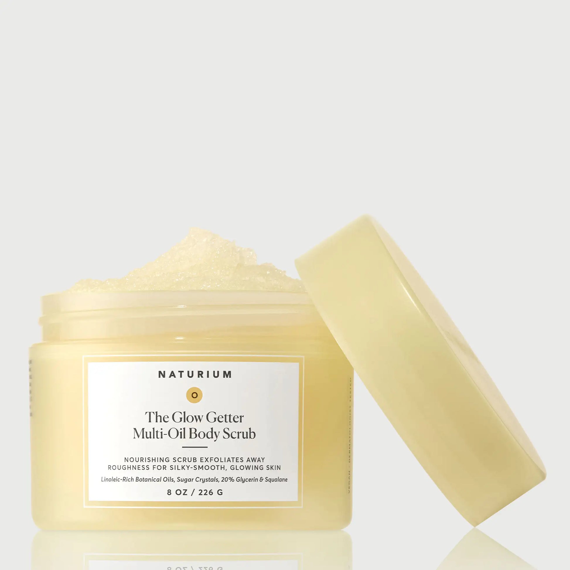 the-glow-getter-multi-oil-body-scrub-g0 NATR-40028-GlowGetter-Multi-Oil-Body-Scrub-Front-CapOff-bonebkgd.webp